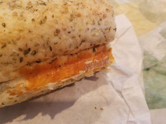 Italian Herbs and Cheese bread loaf with hair baked into sandwich