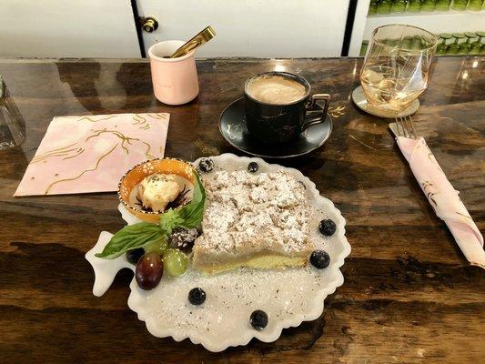 Raspberry crumb cake with latte.