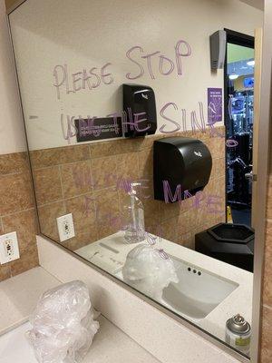 Men's restroom sink with non-functional faucet/sink; unrepaired for MANY MONTHS.