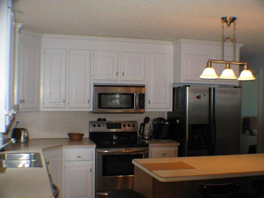 Newly painted cabinets from Clearcoat Oak to California Ultra  waterborne white. 3/18