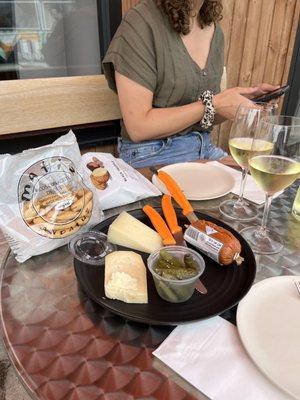 Self-made charcuterie plate and wine