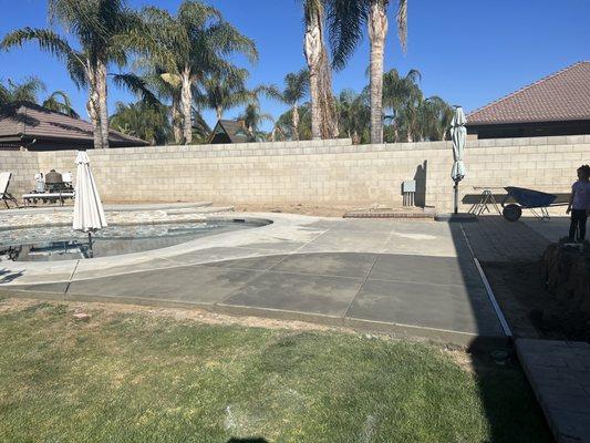 Added two rows to block wall and new concrete to extend our pool deck.