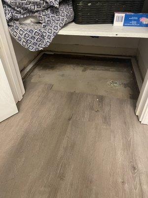 Bathroom. Didn't bother to finish laying the flooring in the closet. Why are they asking for $2700 more for a job they couldn't even finish