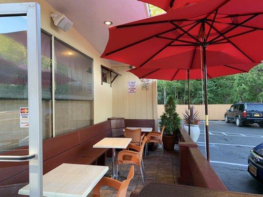 Cute little booth type setup on each side. Perfect for outdoor dining...when it's warm out.