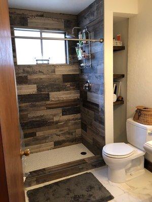 Tile work in both bathrooms pictured as well as kitchen done by G-Pro