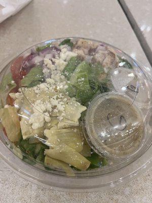 Small Greek salad with chicken $9.99 See the 2 dressings thank you It also came with a piece of sourdough bread