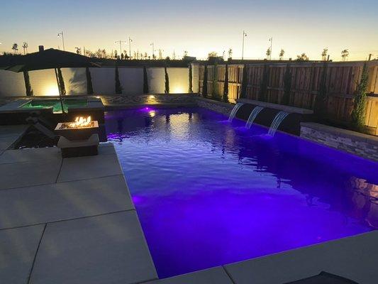 Look at this beautiful pool and spa at night in River Islands ,Lathrop. Stunning fire feature and awesome LED lights!!