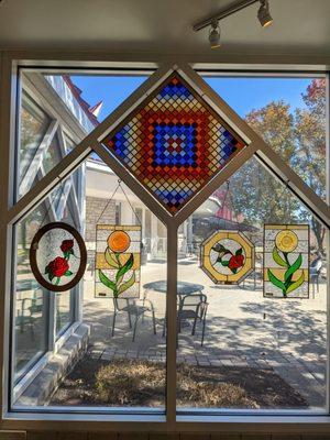 Stained glass hung up by the courtyard