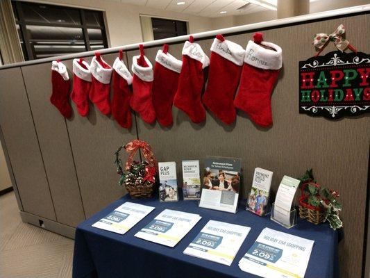 Stockings are hung at Schools First with care, in hopes that new members soon will be there.