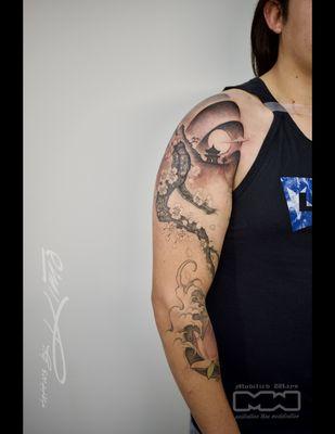 Asian style sleeve tattoo.