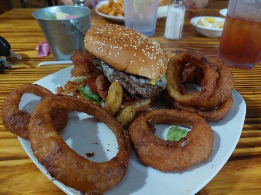 1/2 lb hamburger with fried jalepenos and onions and onion rings.