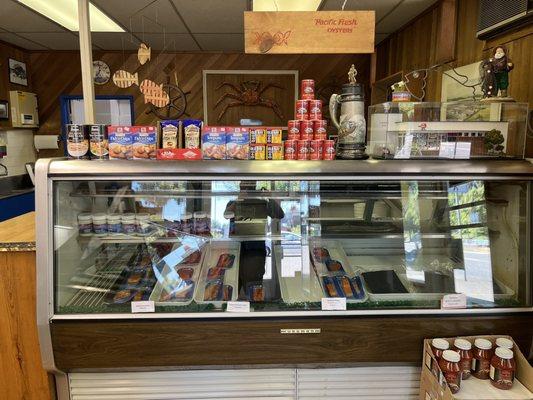 Side deli case with seafood seasons, accoutrements, and pre-packaged smoked fish. Yum!