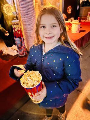 Little Mama eating popcorn