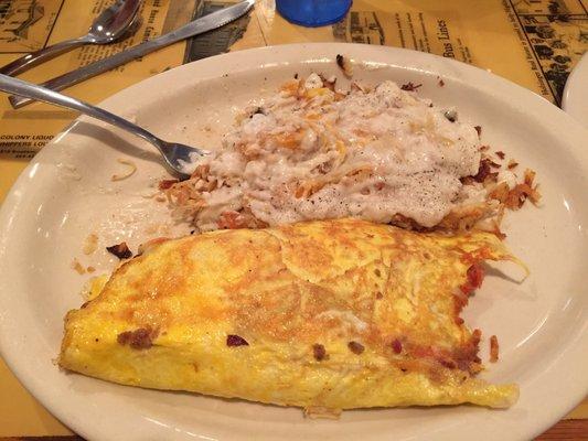 Meat lovers omelet with smothered hash browns