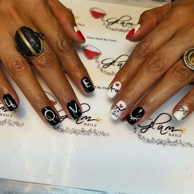 30 day gel manicure with hand painted designs. Nails are cured when you leave so no smudging.