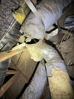 Old and damaged ductwork in attic