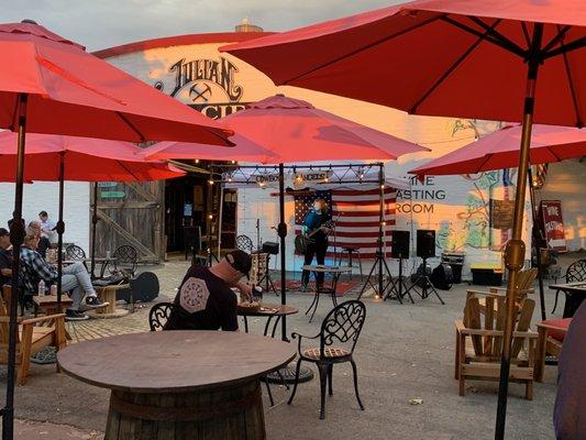 Woman singing on the patio at open mic night