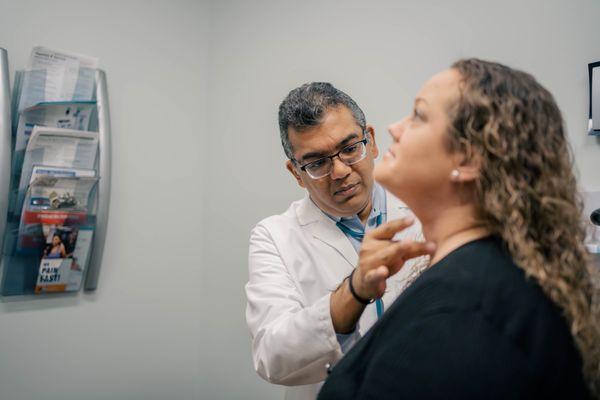 Dr. Sarma examines a patient