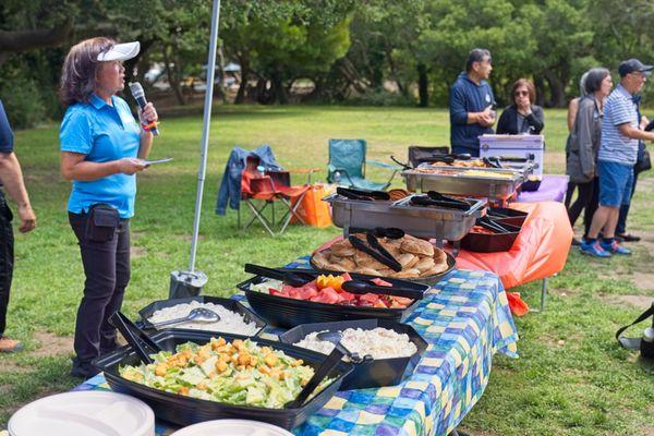 BBQ menu ... pork ribs, chicken, burgers, Caesar salad, potato salad, watermelon and honeydew fruit bowl.