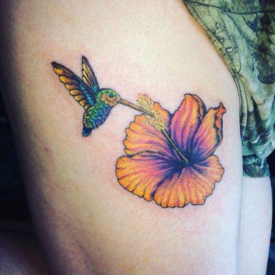 Hummingbird And hibiscus Tattoo done by Ricky G at Xtreme ink.