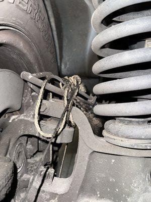 The string they left tied to the my brake lines.