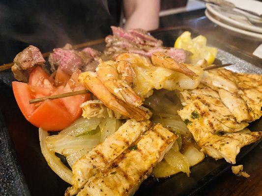 Three meat fajitas: steak, chicken, shrimp