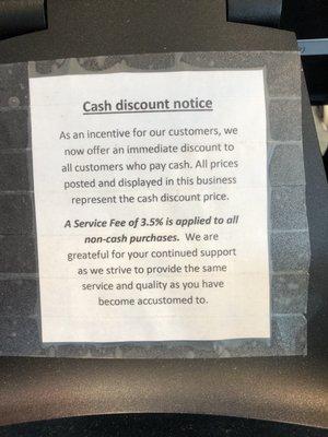 Cash discount sign on register, July 2023