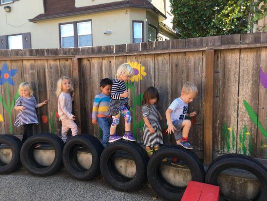 Preschool children enjoy time outdoors - rain or shine.