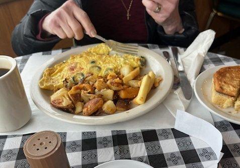 Greek Omelette with Home Fries.