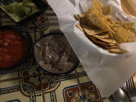 Chips with black bean salsa, house medium, and guacamole.  The guacamole is $5.....