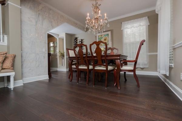 Wide dark stained oak wood floors.