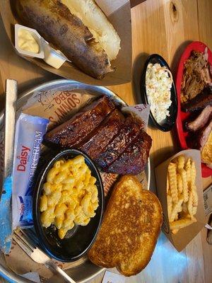 (Left) Sides: Baked Potato, Macaroni, Garlic Bread Order: St.Louis Ribs (Right) Sides: Fries, Coleslaw, Garlic Bread Order: Pork 3 Ways