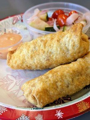 Egg roll with tomato, onion, cucumber salad