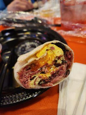 Delicious pastrami burrito for breakfast I think it had corned beef in it too it was fantastic and a steal for 9 bucks are you kidding me?