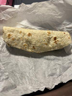 Regular sized, chorizo, egg ,potato and cheese breakfast burrito.