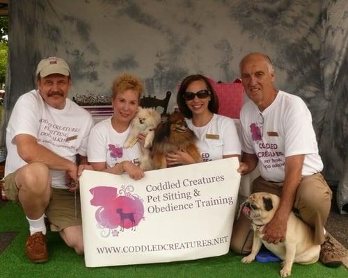 Several of Coddled Creatures Pet Care Specialists with our director of training.