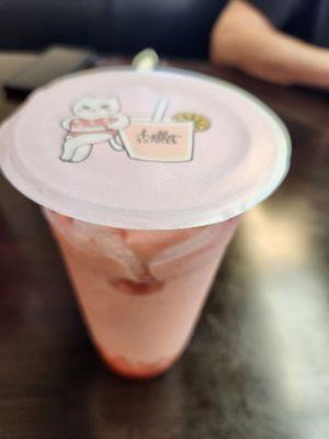 Strawberry bubble tea (blended) with strawberry popping boba!