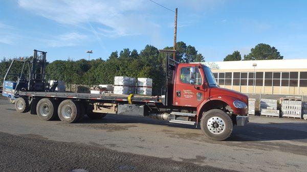 Delivery  truck with piggyback forklift