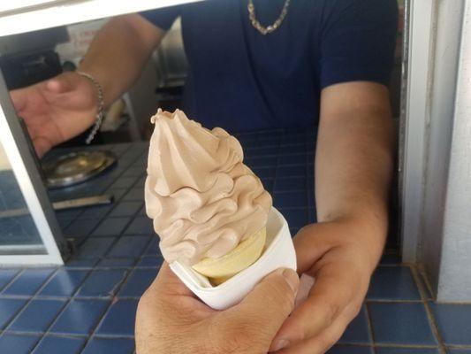 Really nice, informative  young man from Westmorland serving chocolate soft serve ice cream.