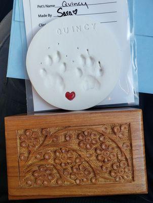 Clay paw print with his urn