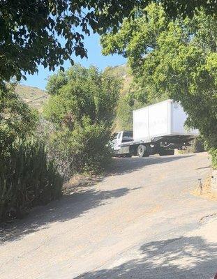 Storage container towed up a hill