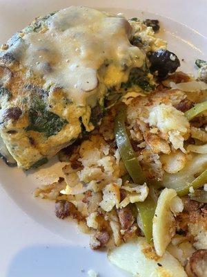 Spinach omelet with mushrooms and sausage added