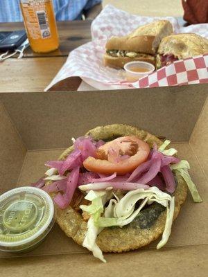 Panucho in the foreground and torta with cochinita pibil