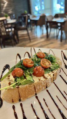 Spinach cherry tomato hummus toast