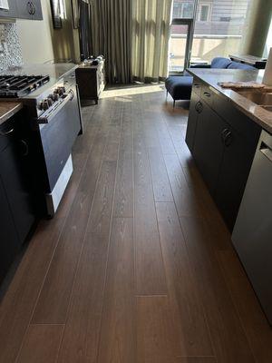 Installed luxury vinyl planks with a natural beveled edge