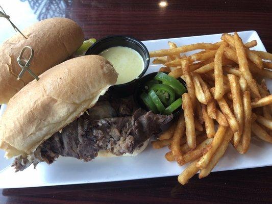 Philly steak sandwich with peppers and a good dipping sauce