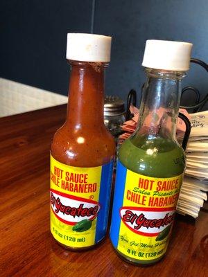 Two chili habanero sauces at every table