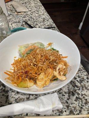 Chicken pad Thai and half a spring roll.