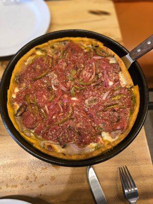 Medium pizza with mushroom, red onions, green peppers and sausage.