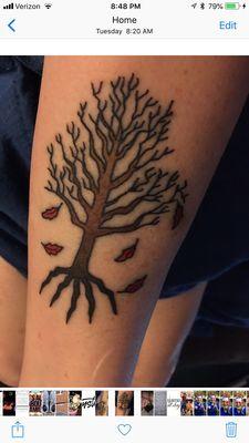 There are 5 roots to the tree and 5 red leaves falling. They represent my 5 daughters. Kelly, Laura, Megan, Lindsey and Macy.